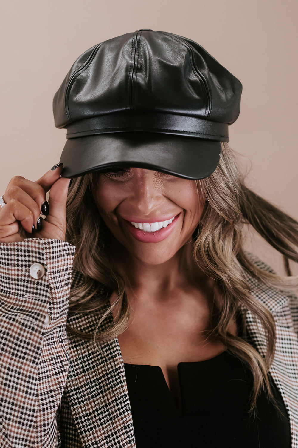 Brown leather newsboy store hat