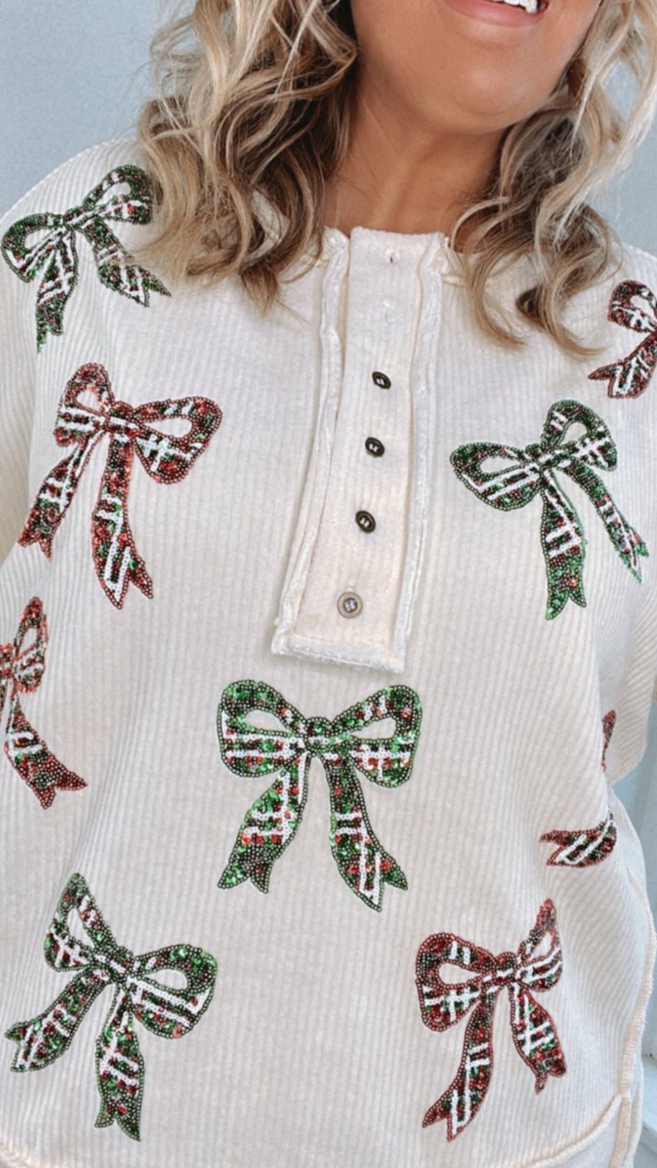 Full Of Cheer Sequin Bow Long Sleeve Top