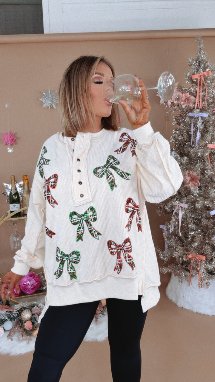 Full Of Cheer Sequin Bow Long Sleeve Top