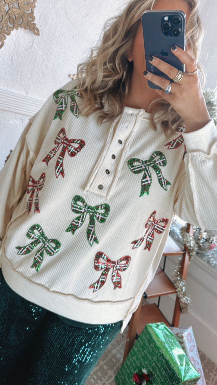 Full Of Cheer Sequin Bow Long Sleeve Top