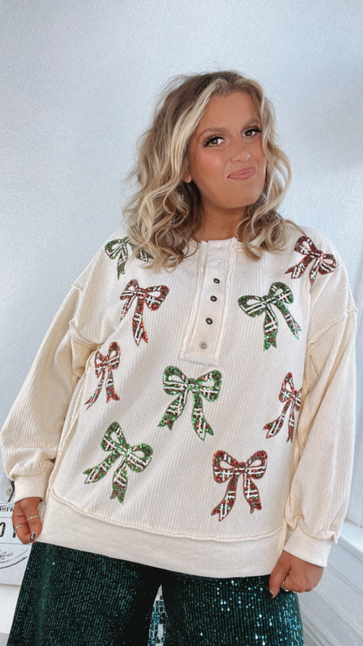 Full Of Cheer Sequin Bow Long Sleeve Top